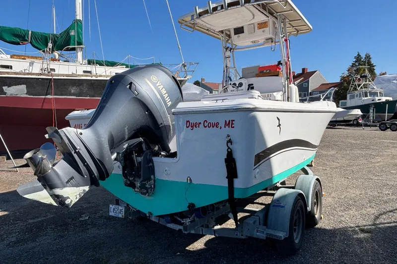 Slide: The Image of 2004 Pro-Line 20 Sport boat with Yamaha outboard motor, parked on a trailer in Dyer Cove, ME. - 3