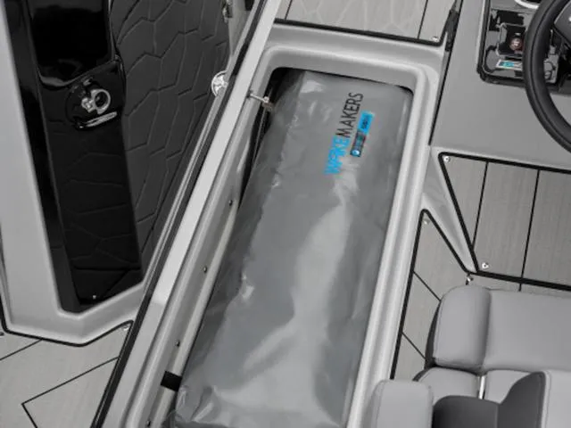 Slide: The Image of 2024 Yamaha Boats 255XD displayed outside a dealership with a New Model banner. - 9