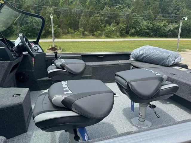 Slide: The Image of 2024 Lund 1875 Impact XS Sport boat interior with swivel seats. - 11