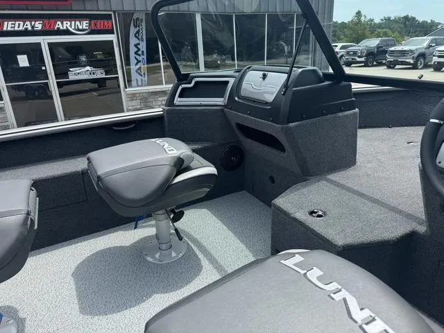 Slide: The Image of 2024 Lund 1875 Impact XS Sport boat interior with seating and console. - 15