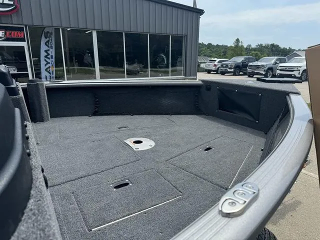 Slide: The Image of 2024 Lund 1875 Impact XS Sport boat interior at dealership. - 4