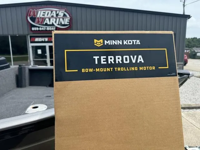 Slide: The Image of Box of Minn Kota Terrova trolling motor near 2024 Lund 1875 Impact XS Sport boat at Wieda's Marine. - 5