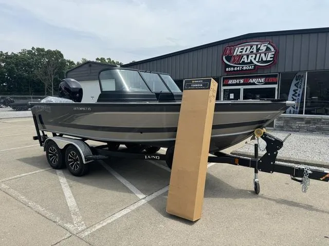 Slide: The Image of 2024 Lund 1875 Impact XS Sport boat on trailer at dealership. - 6