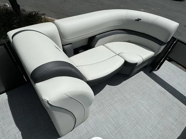Slide: The Image of 2024 Starcraft EXS 3 HB4 boat with luxurious white and gray seating. - 11