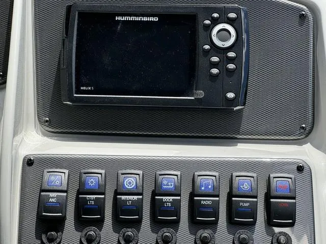 Slide: The Image of Control panel of 2024 Starcraft EXS 3 HB4 with Humminbird Helix 5. - 18