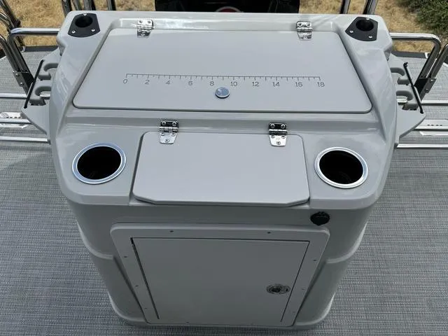 Slide: The Image of 2024 Starcraft EXS 3 HB4 boat console with cup holders and storage. - 22