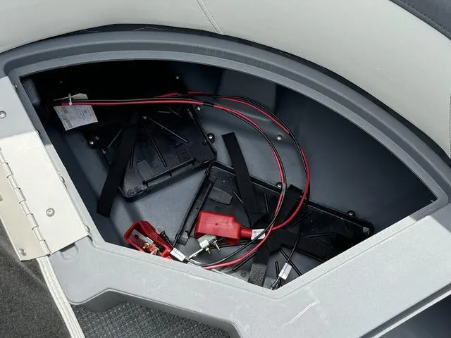 Slide: The Image of Battery compartment of 2024 Starcraft EXS 3 HB4 pontoon boat. - 28