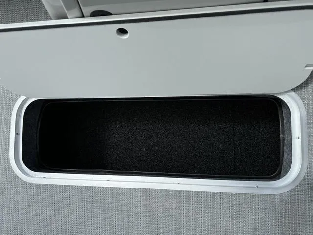 Slide: The Image of Open storage compartment in 2024 Starcraft EXS 3 HB4 boat. - 30
