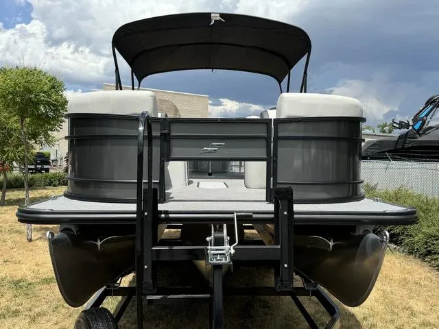 Slide: The Image of 2024 Starcraft EXS 3 HB4 pontoon boat on trailer, front view. - 6