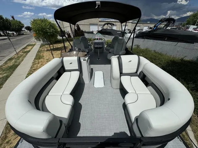 Slide: The Image of 2024 Starcraft EXS 3 HB4 pontoon boat with spacious seating and canopy. - 9