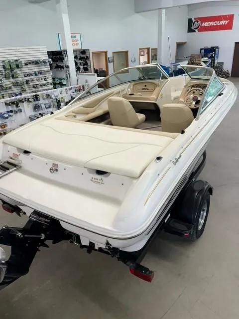 Slide: The Image of 2000 Sea Ray 185 Bow Rider boat in showroom, rear view. - 8