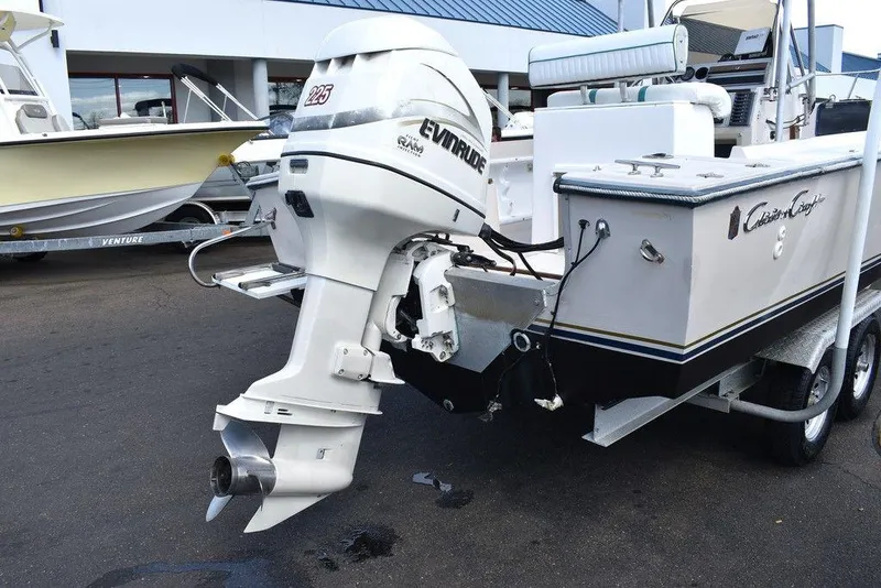 Slide: The Image of 1987 Chris-Craft 213 SeaHawk CC boat with Evinrude outboard motor on trailer. - 13