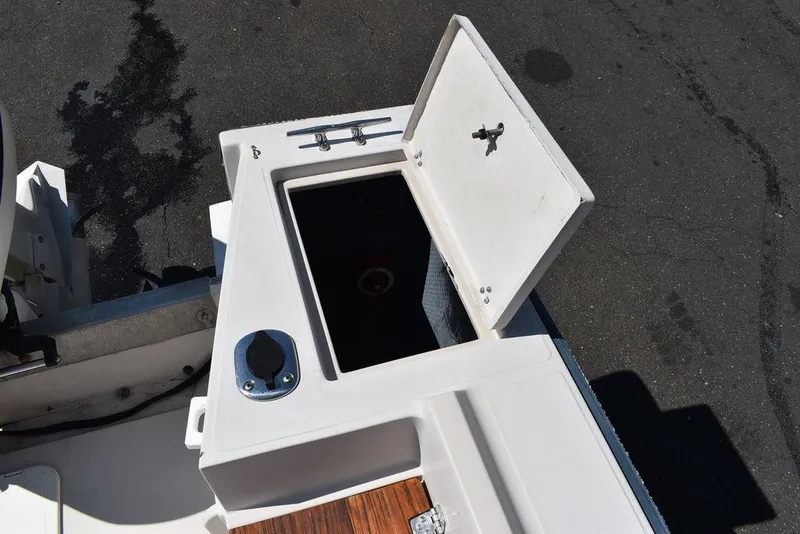 Slide: The Image of Open storage compartment on a 1987 Chris-Craft 213 SeaHawk CC boat. - 18