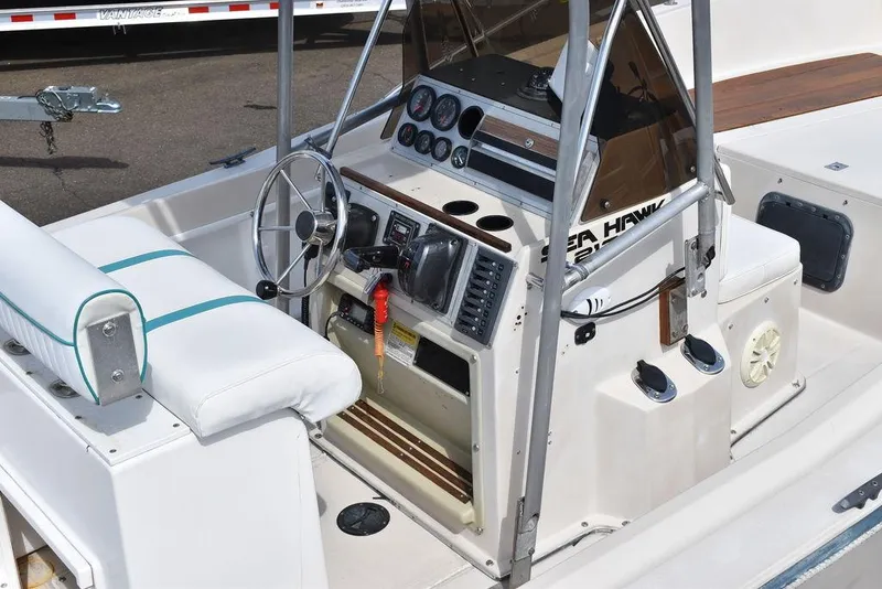 Slide: The Image of 1987 Chris-Craft 213 SeaHawk CC boat cockpit with steering wheel and control panel. - 21