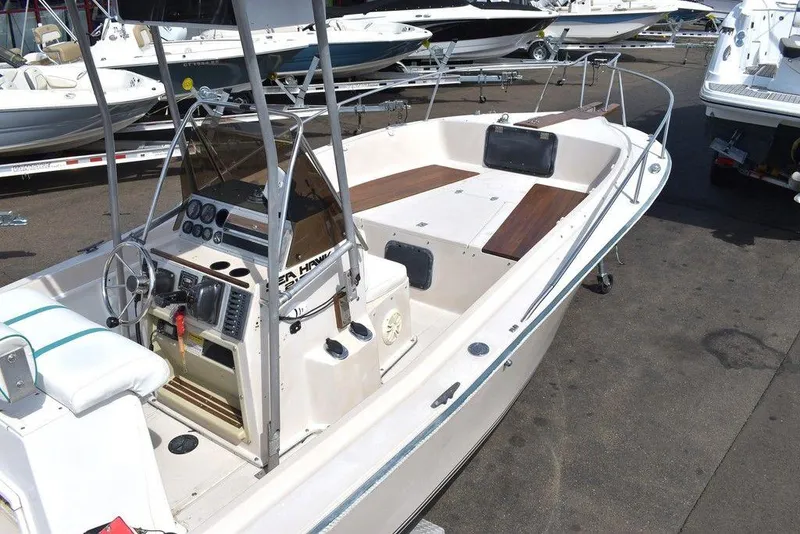 Slide: The Image of 1987 Chris-Craft 213 SeaHawk CC boat with center console and spacious deck. - 23