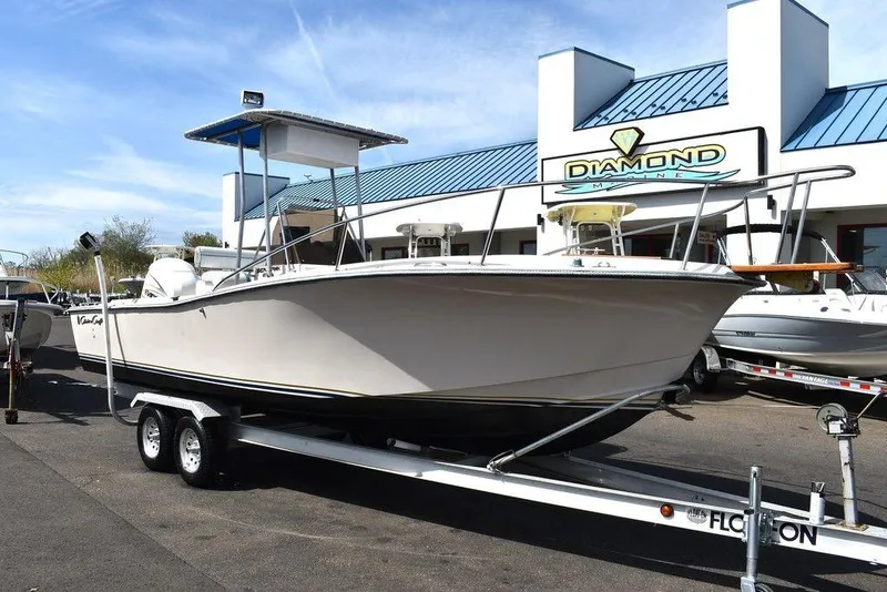 Slide: The Image of 1987 Chris-Craft 213 SeaHawk CC boat on trailer outside dealership. - 24