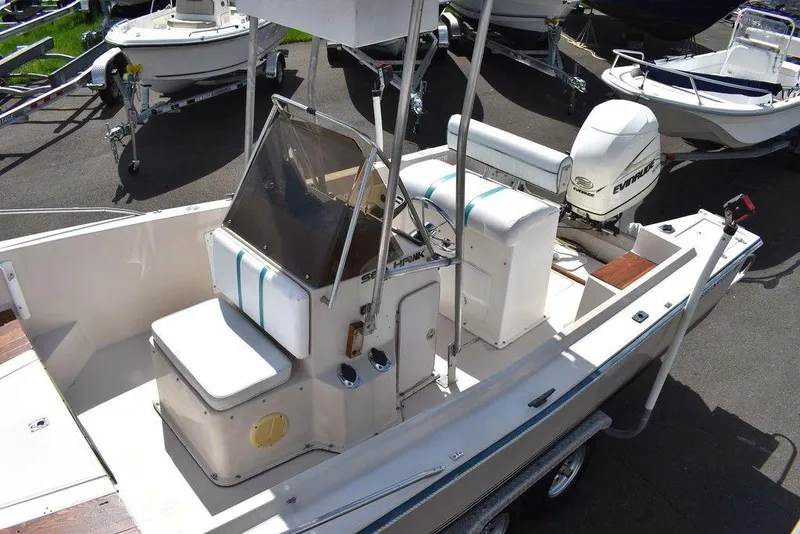 Slide: The Image of 1987 Chris-Craft 213 SeaHawk CC boat with center console and Evinrude outboard motor. - 27