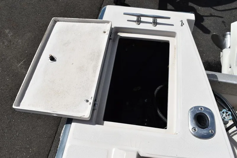 Slide: The Image of 1987 Chris-Craft 213 SeaHawk CC open storage compartment on deck. - 28