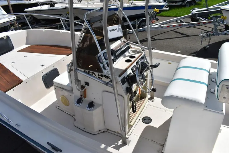 Slide: The Image of 1987 Chris-Craft 213 SeaHawk CC boat interior with steering console and seating. - 31
