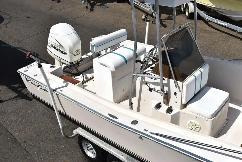 Slide: The Image of 1987 Chris-Craft 213 SeaHawk CC boat with Evinrude outboard motor on trailer. - 35