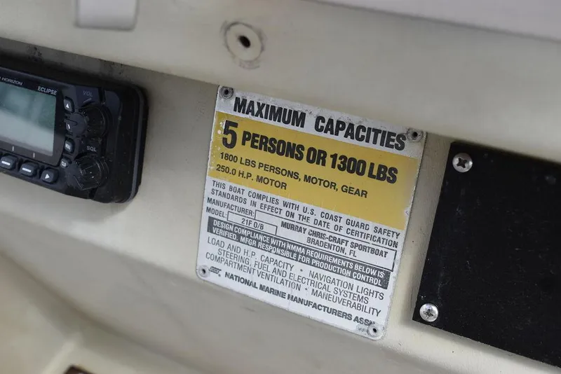 Slide: The Image of 1987 Chris-Craft 213 SeaHawk CC capacity plate, 5 persons or 1300 lbs, 250 HP motor. - 38