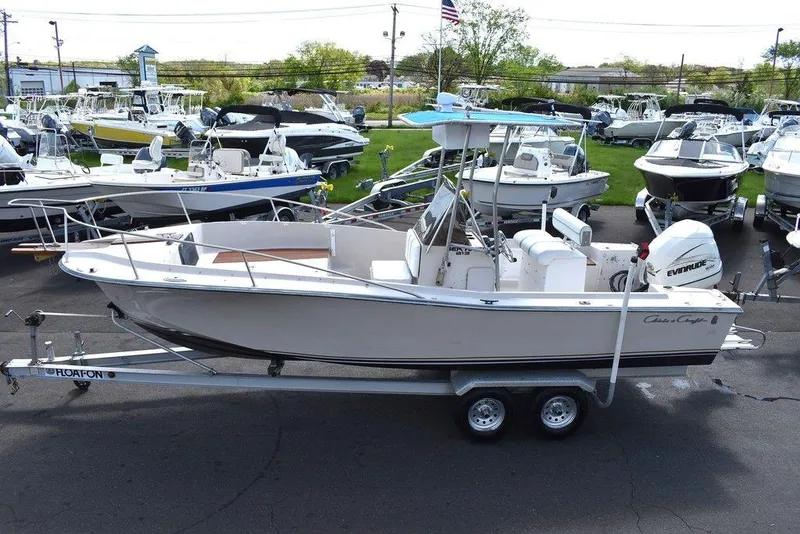 Slide: The Image of 1987 Chris-Craft 213 SeaHawk CC boat on a trailer in a marina. - 4