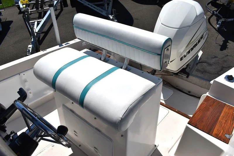 Slide: The Image of 1987 Chris-Craft 213 SeaHawk CC boat interior with white and teal seating. - 42