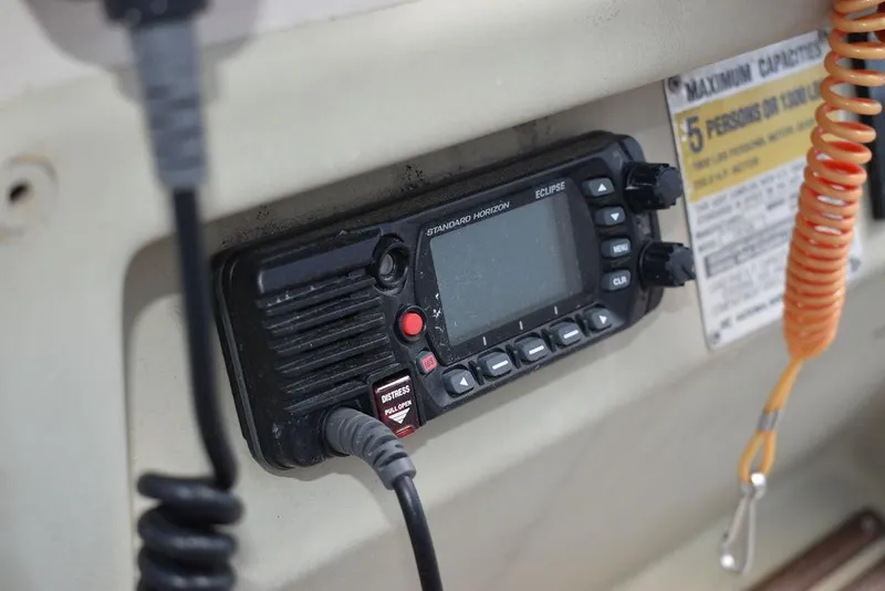 Slide: The Image of VHF radio on a 1987 Chris-Craft 213 SeaHawk CC boat dashboard. - 44