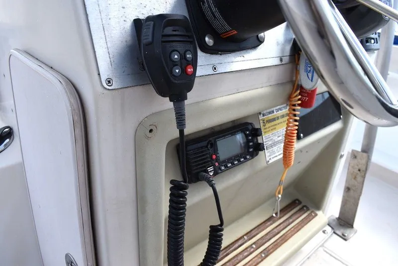 Slide: The Image of 1987 Chris-Craft 213 SeaHawk CC boat console with radio and steering wheel. - 47