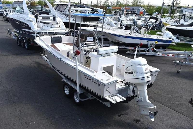 Slide: The Image of 1987 Chris-Craft 213 SeaHawk CC boat on a trailer in a marina. - 5