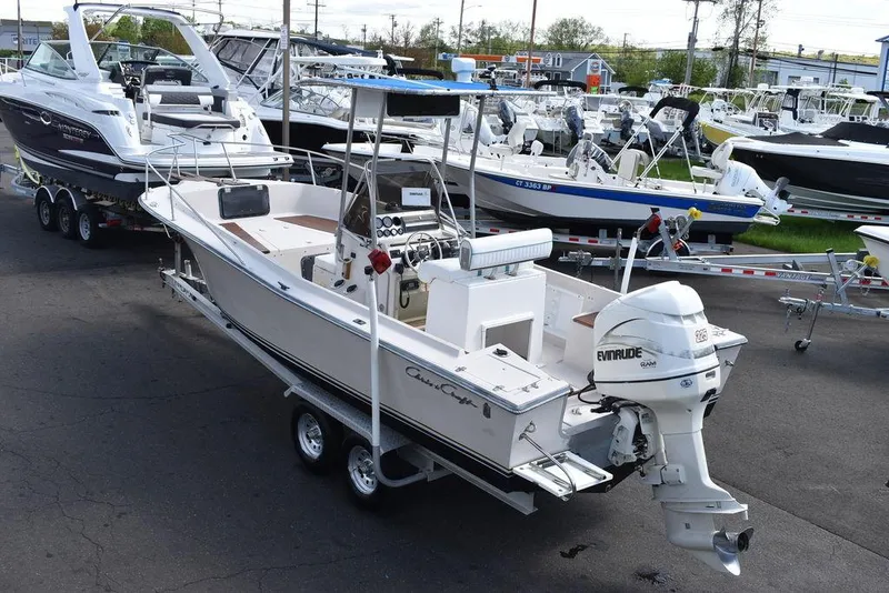 Slide: The Image of 1987 Chris-Craft 213 SeaHawk CC boat on trailer in marina. - 6