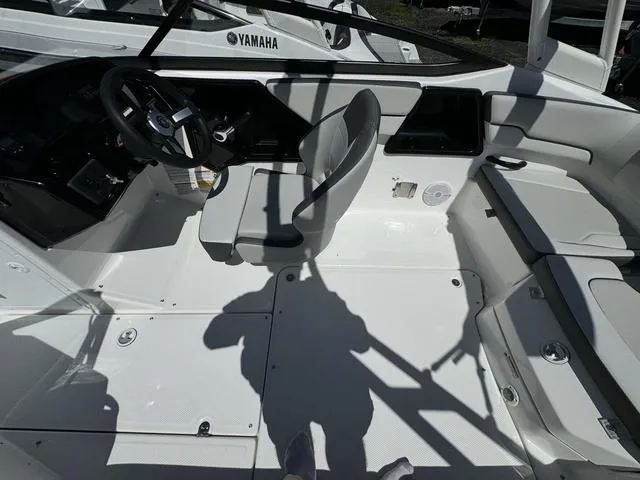 Slide: The Image of 2024 Yamaha Boats AR190 interior cockpit with steering wheel and seating. - 15