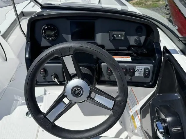 Slide: The Image of 2024 Yamaha Boats AR190 steering console with controls and display. - 17