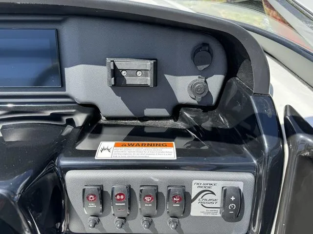 Slide: The Image of 2024 Yamaha Boats AR190 dashboard controls and display panel. - 18