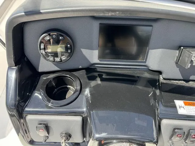 Slide: The Image of 2024 Yamaha Boats AR190 dashboard with control panel and display screen. - 19