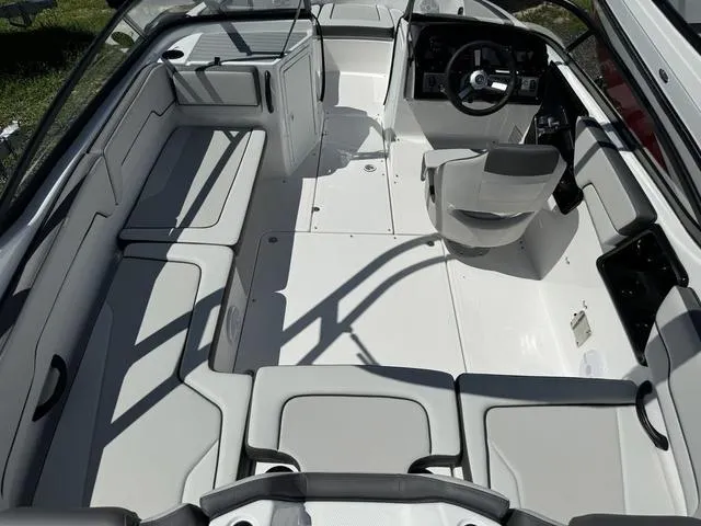 Slide: The Image of 2024 Yamaha Boats AR190 interior, spacious seating, modern helm, and sleek design. - 5