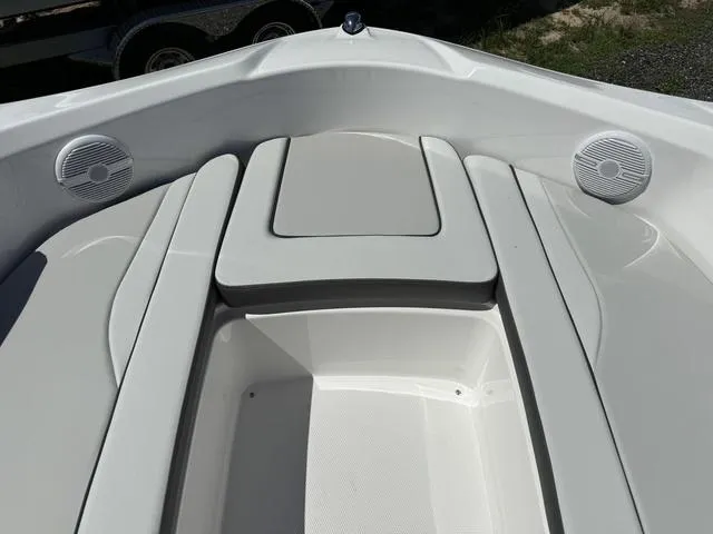 Slide: The Image of 2024 Yamaha Boats AR190 bow seating area with speakers. - 8