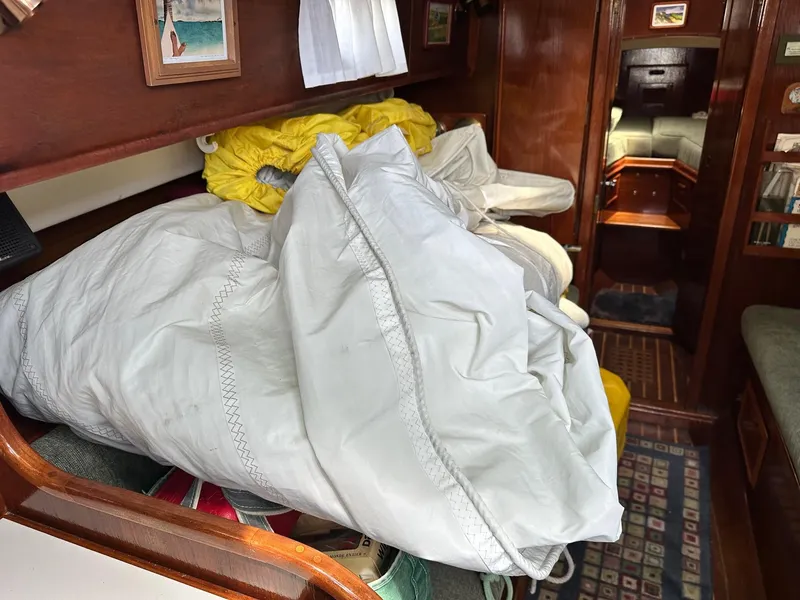 Slide: The Image of Interior of 1982 Cape Dory 30 sailboat with sails and cozy cabin. - 26