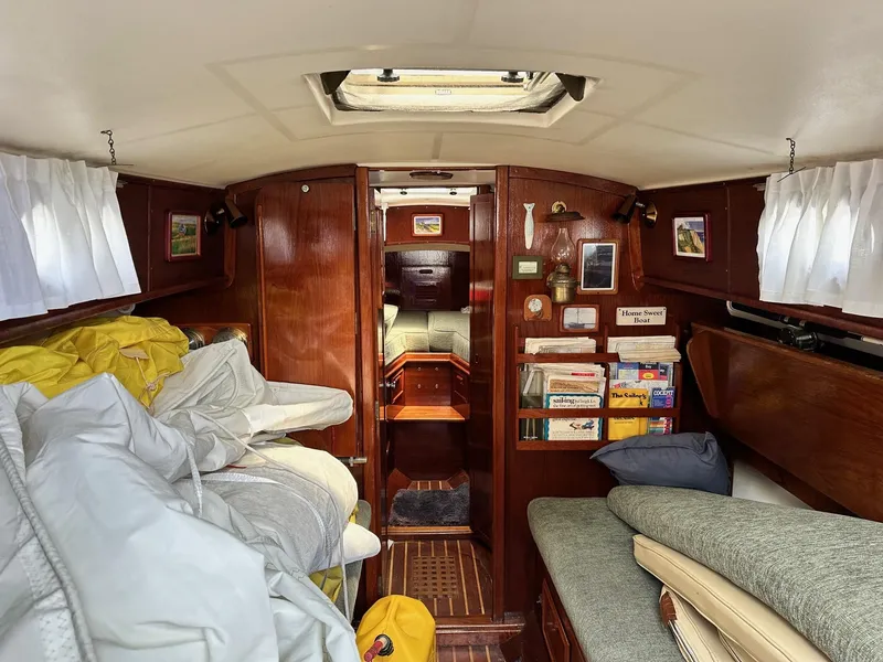 Slide: The Image of Interior of 1982 Cape Dory 30 sailboat with cozy cabin and wooden furnishings. - 27