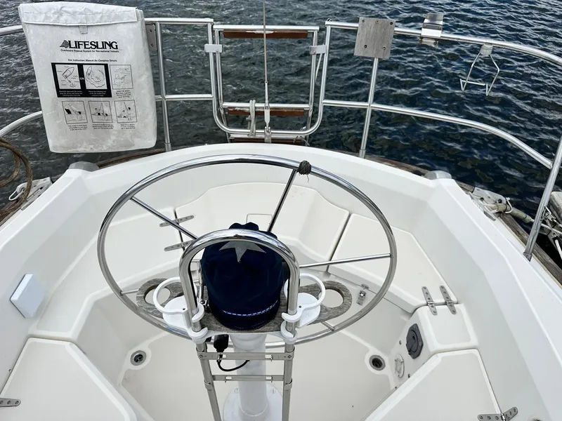 Slide: The Image of Cockpit of 1986 Sabre 30 Sabre MK III sailboat with steering wheel and Lifesling. - 11