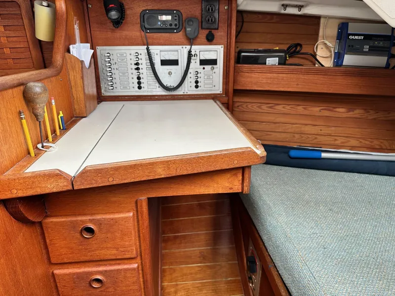 Slide: The Image of Navigation station of a 1986 Sabre 30 Sabre MK III sailboat with control panel and desk. - 17
