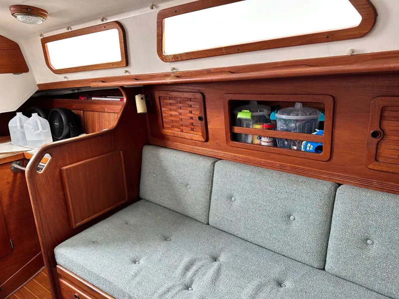 Slide: The Image of Interior of 1986 Sabre 30 Sabre MK III sailboat with wooden cabinetry and cushioned seating. - 20