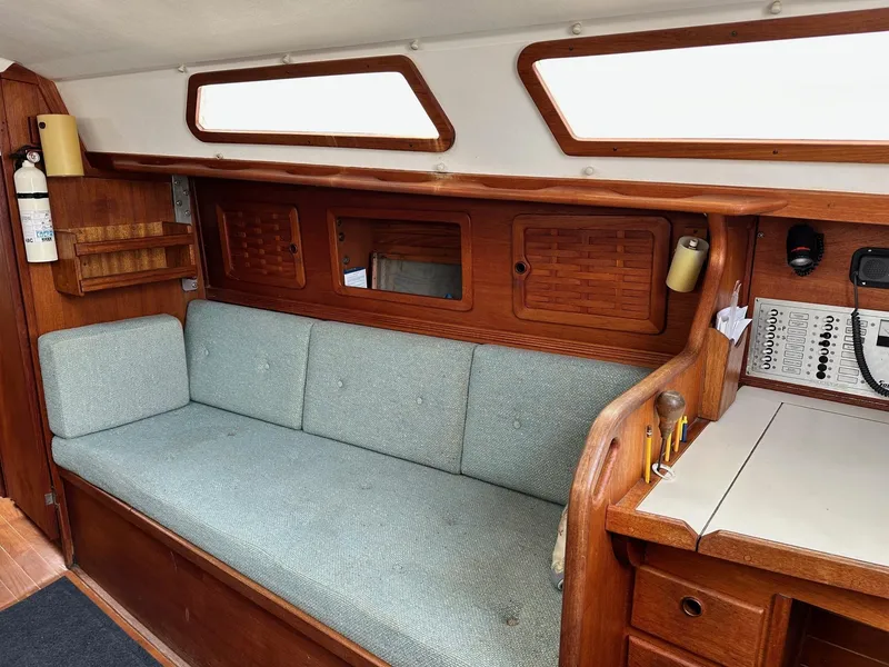 Slide: The Image of Interior of 1986 Sabre 30 Sabre MK III sailboat with wooden cabinetry and cushioned seating. - 23