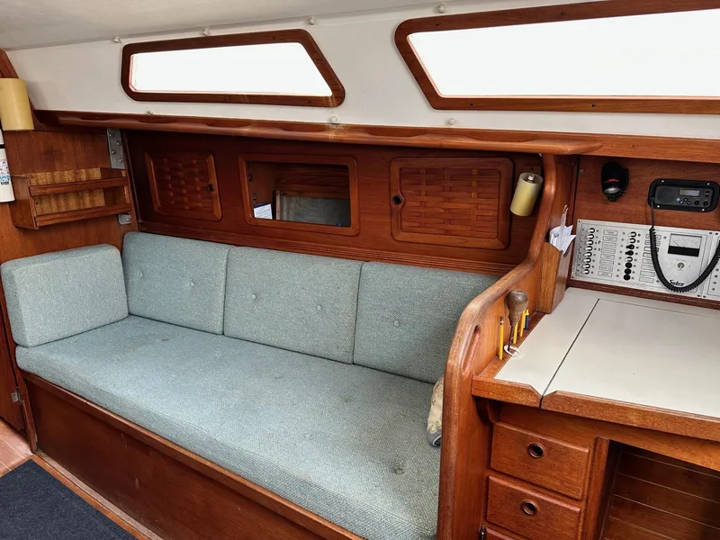 Slide: The Image of Interior of 1986 Sabre 30 Sabre MK III sailboat with wooden cabinetry and cushioned seating. - 24