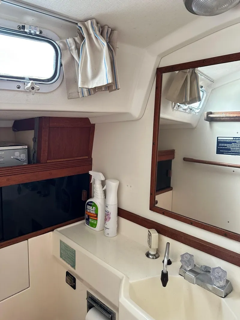 Slide: The Image of Interior of 1986 Sabre 30 Sabre MK III sailboat bathroom with sink and mirror. - 26