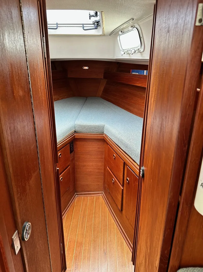 Slide: The Image of Interior cabin of 1986 Sabre 30 Sabre MK III sailboat with wooden finish and V-berth. - 28