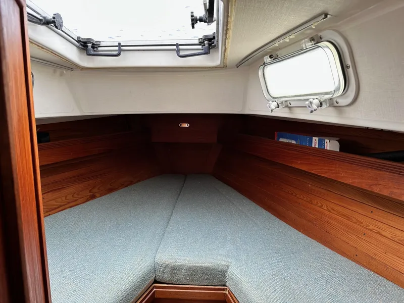 Slide: The Image of Interior cabin of 1986 Sabre 30 Sabre MK III sailboat with wooden trim and cushioned berth. - 33