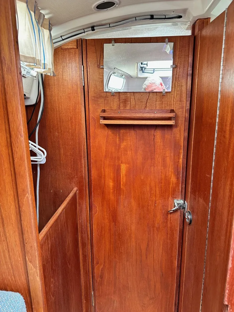 Slide: The Image of Interior of 1986 Sabre 30 MK III sailboat with wooden door and mirror. - 36
