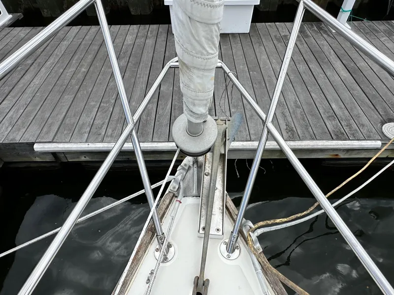 Slide: The Image of Bow of 1986 Sabre 30 Sabre MK III sailboat docked at a wooden pier. - 7