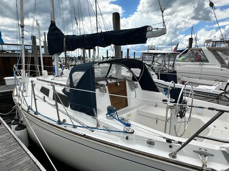Slide: The Image of 1986 Sabre 30 Sabre MK III sailboat docked at marina under cloudy sky. - 8